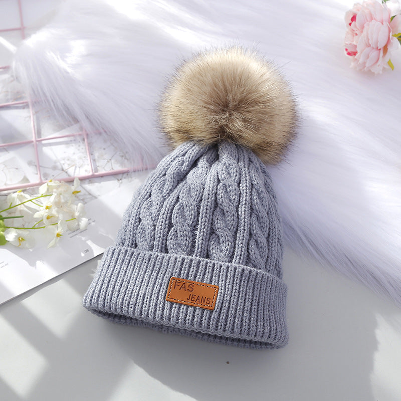 children in winter clothing with beanie hats