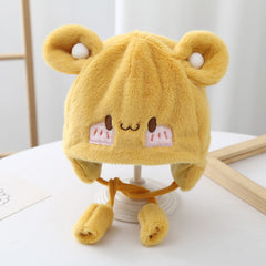 Toddler wearing a cute plush winter beanie