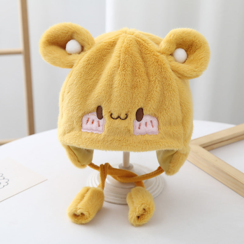 Toddler wearing a cute plush winter beanie