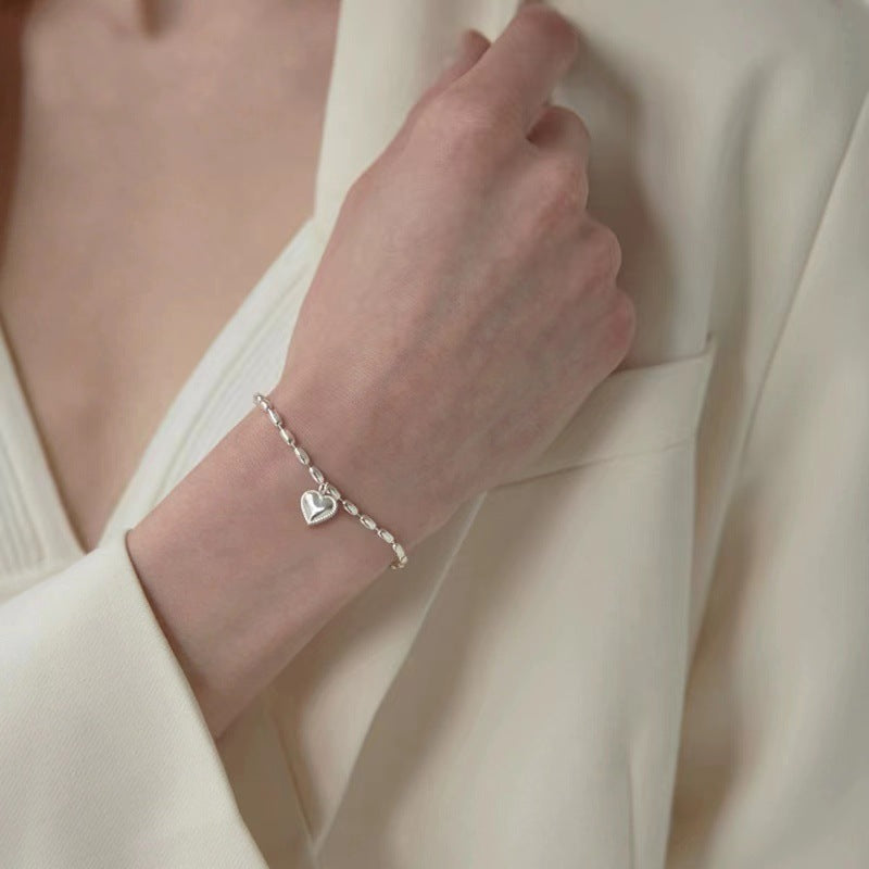 Elegant women's charm bracelet displayed on a wrist