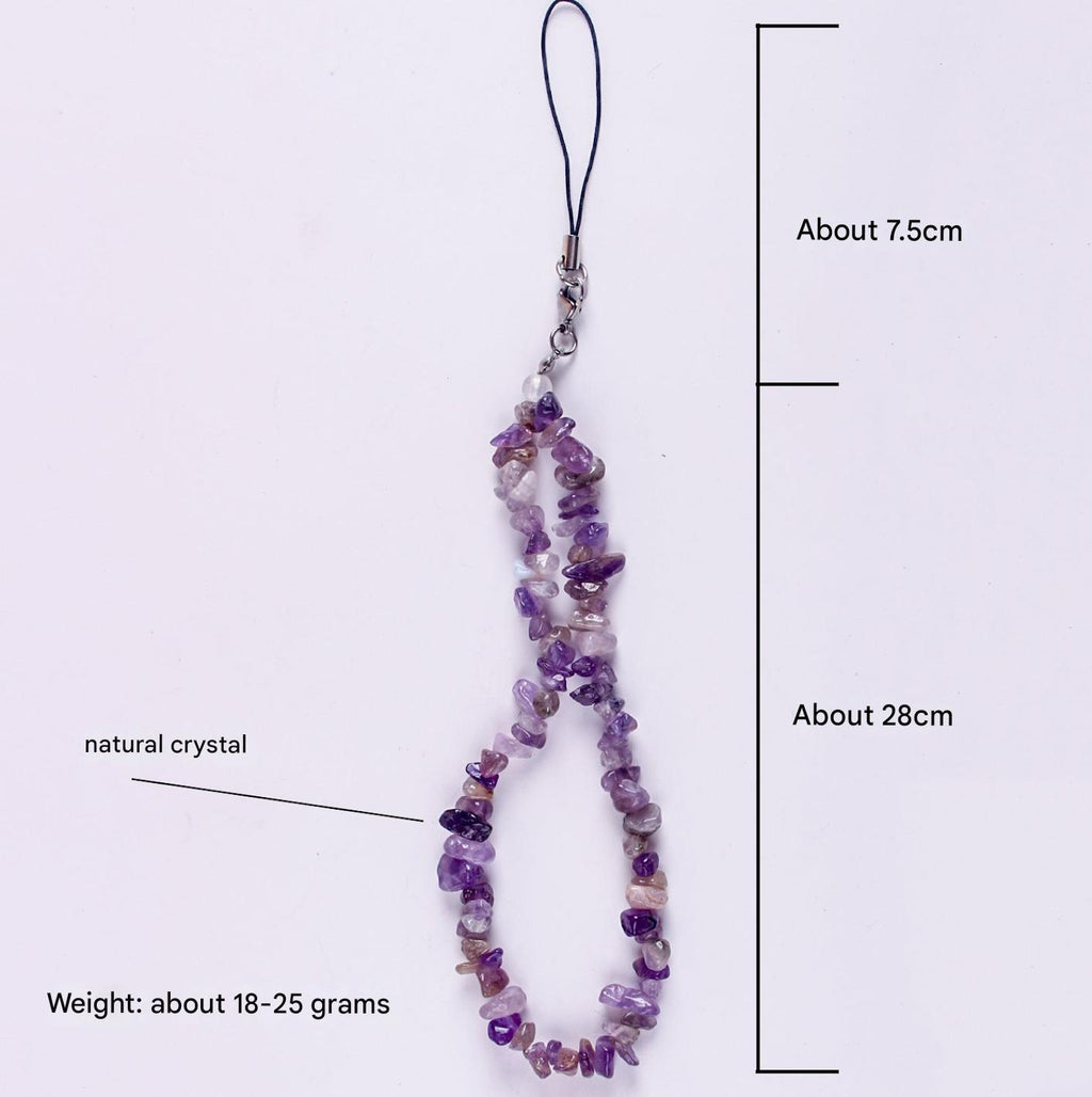 Close-up of colourful crystals on phone strap