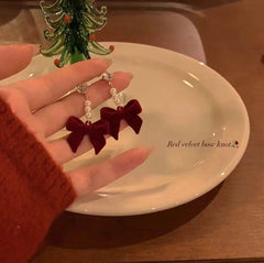 Close up of designer pearl stud earrings