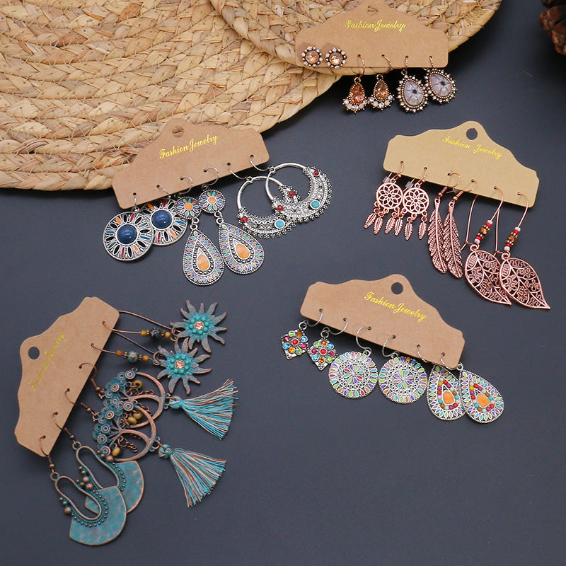 Geometric tassel earrings shown in three pairs