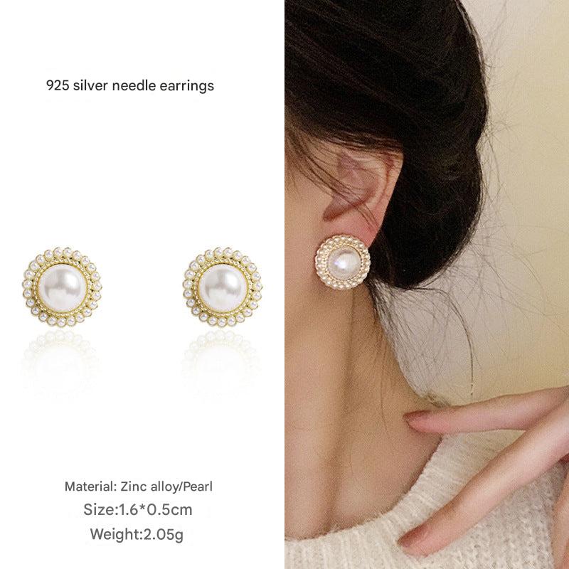 Close-up of flower pearl earrings 3