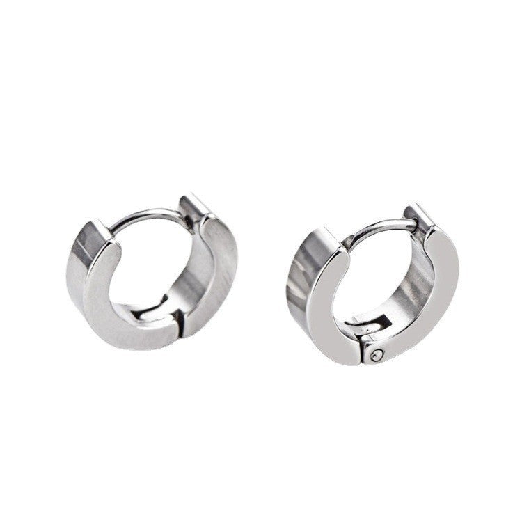 Multi-coloured titanium earrings flat lay