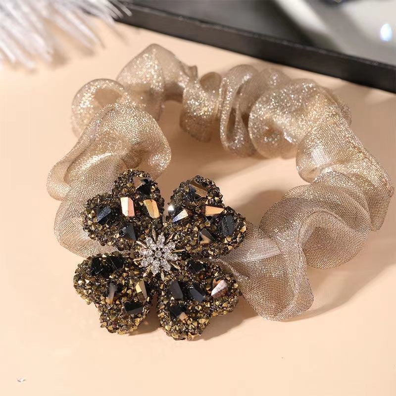 elegant gold clover pattern hair tie