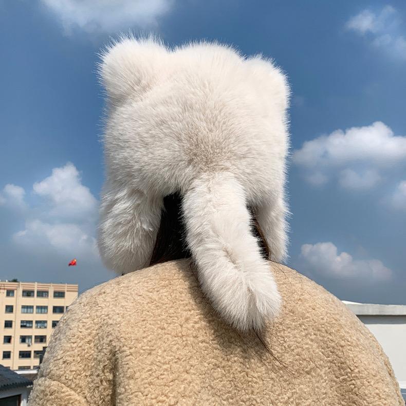 Cute plush winter hat with bear ears on model