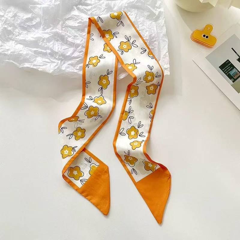 yellow scarf tied to bag