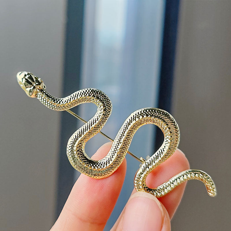 Stylish snake brooch showcased on a table