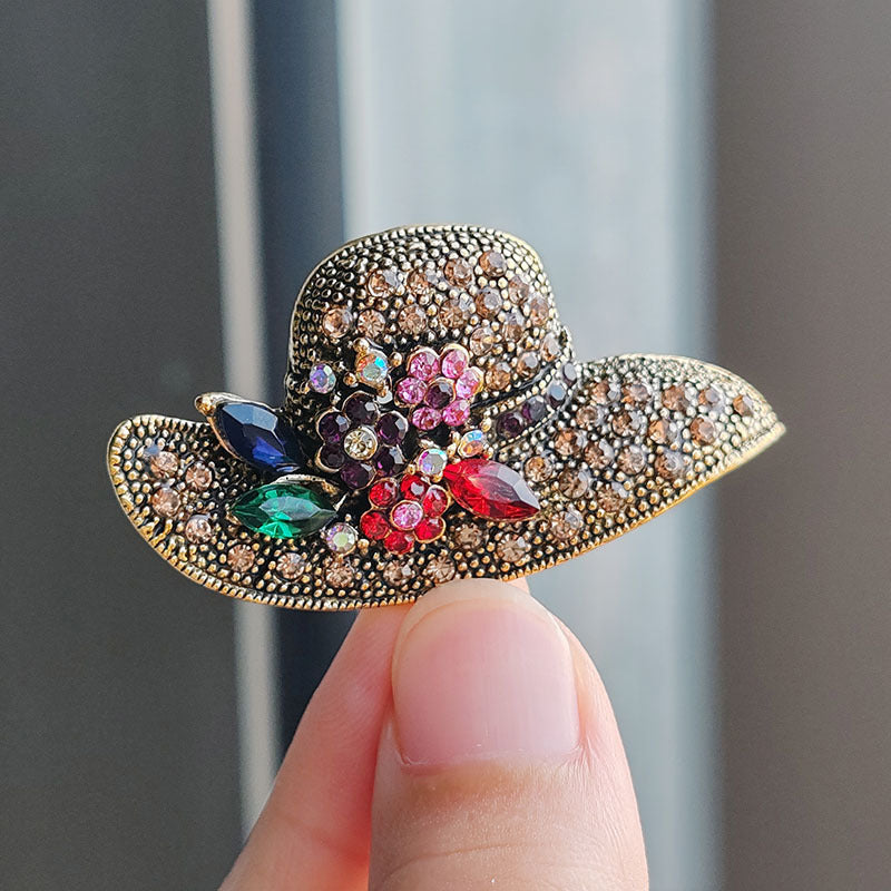 Elegant rhinestone brooch displayed on fabric
