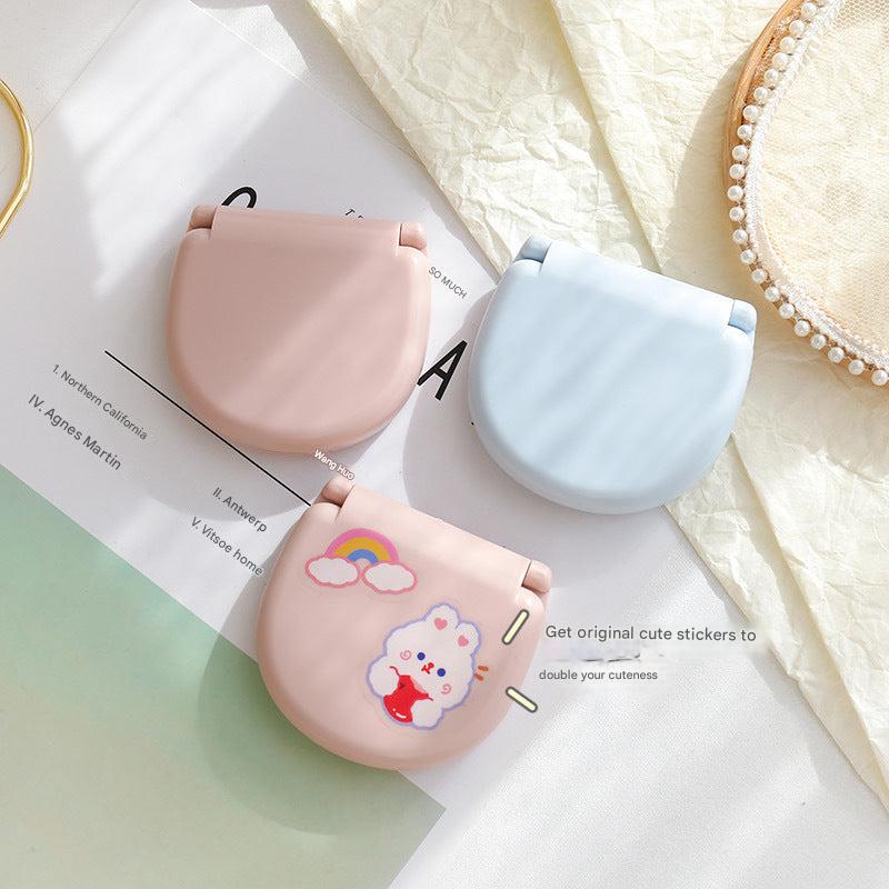 Essential sewing tools in a mini sewing box