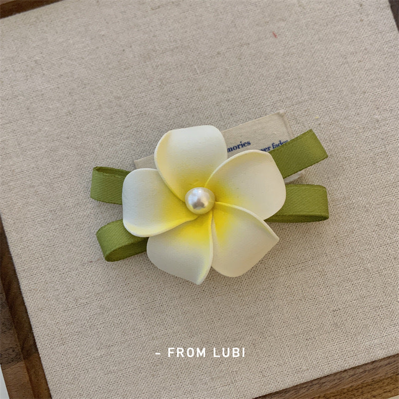 Detailed view of floral hair accessories